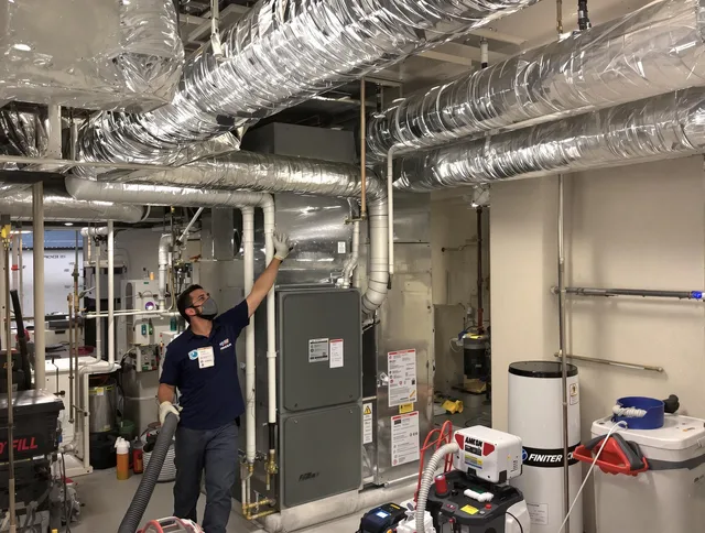 Warwick Air Duct Cleaning specialist performing thorough furnace duct cleaning in a Warwick residence