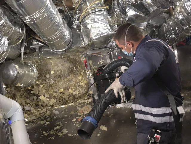Warwick Air Duct Cleaning specialist operating negative pressure cleaning equipment for thorough duct maintenance in Warwick