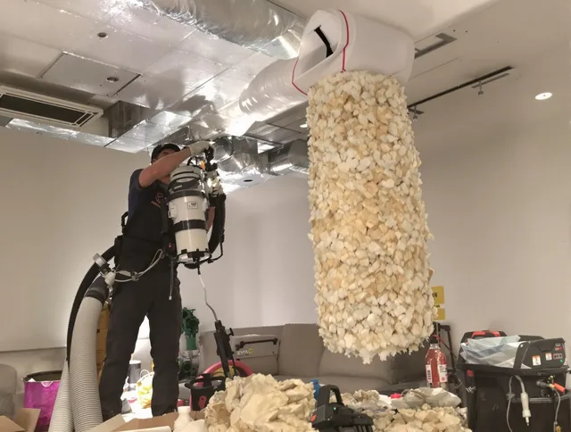 Warwick Air Duct Cleaning technician performing precision vacuum insulation removal in a residential property in Warwick